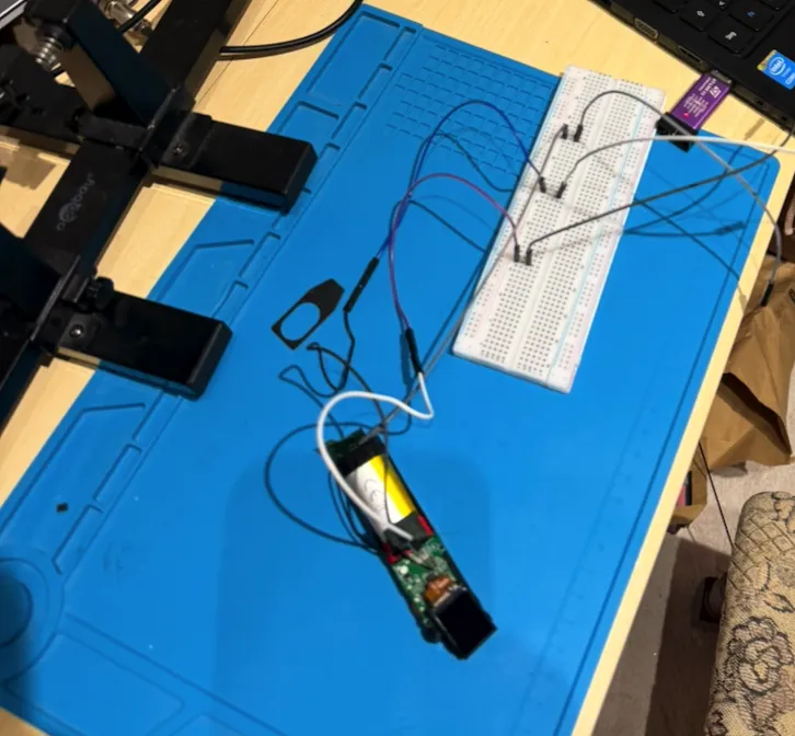 The two-needle breadboard rig wired to the ST-Link