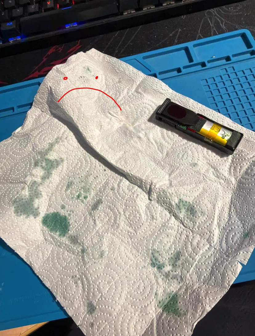 The main board pulled out, covered in vape juice
